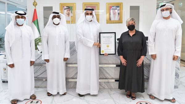 Mohammed Ali Rashid Lootah (3rd left)) hands over the certificate to Despina Kokkaraki (2nd right), Customer Centricity Director at Al-Futtaim Automotive Dubai Economy Awards Consumer-friendly Standards Certificate To Al-Futtaim Automotive