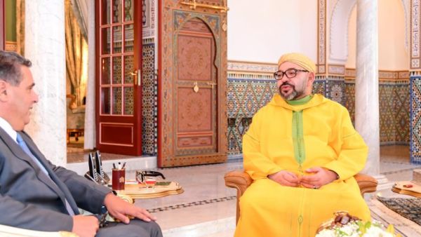 اخنوش ومحمد السادس