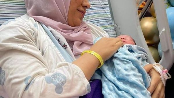 Anhar Al Deek with her baby 
