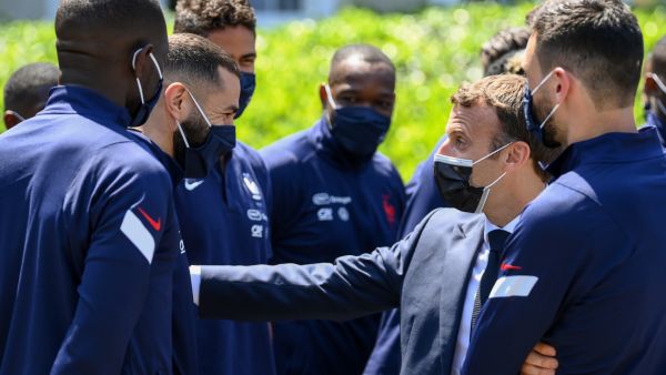 French President Emmanuel Macron (2nd-R) speaks with France's forward Karim Benzema (2nd-L) before a lunch in Clairefontaine-en-Yvelines on June 10, 2021 ahead of the UEFA EURO 2020 football competition. (Photo: AFP)