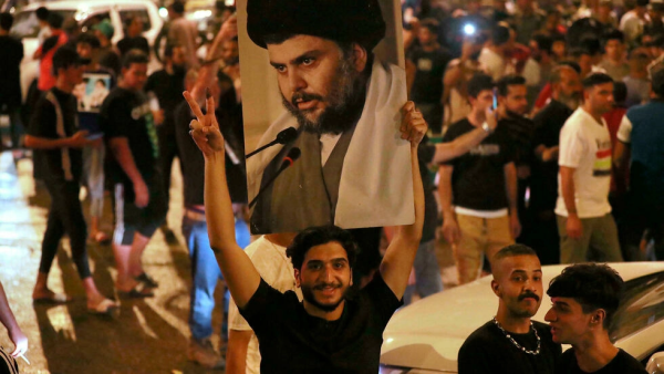 Supporters of Iraqi Shiite cleric Moqtada Sadr celebrate in Baghdad