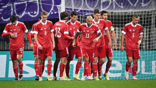 Russia’s players celebrate after scoring a goal during the FIFA World Cup Qatar 2022 qualification Group H football match between Slovenia and Russia at the Ljudski vrt Stadium in Maribor on October 11, 2021. (Photo by Jure Makovec / AFP)