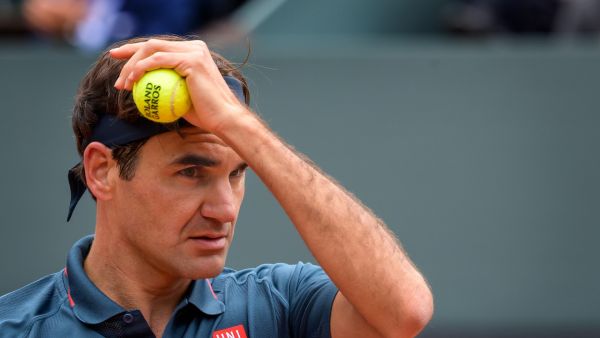 Switzerland's Roger Federer reacts during his ATP 250 Geneva Open tennis match against Spain's Pablo Andujar on May 18, 2021 in Geneva. / AFP / Fabrice COFFRINI