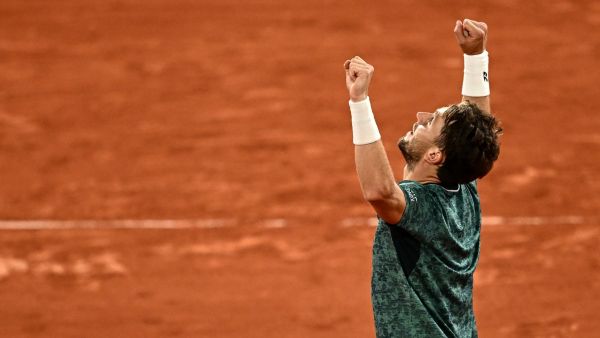 Norway's Casper Ruud reacts after winning against Croatia's Marin Cilic at the end of their men's semi-final singles match on day thirteen of the Roland-Garros Open tennis tournament at the Court Philippe-Chatrier in Paris on June 3, 2022. (Photo by Anne-Christine POUJOULAT / AFP)