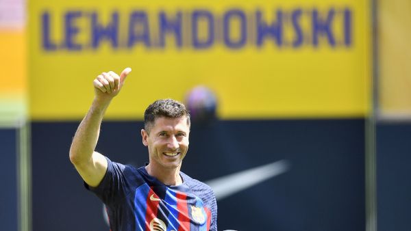 FC Barcelona's Polish forward Robert Lewandowski gestures during his official presentation at the Camp Nou stadium in Barcelona on August 5, 2022. (Photo by Pau BARRENA / AFP)