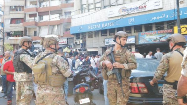 People outside a bank in Beirut 