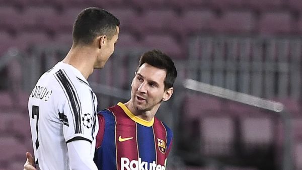 Juventus' Portuguese forward Cristiano Ronaldo greets Barcelona's Argentinian forward Lionel Messi (R) before the UEFA Champions League group G football match between Barcelona and Juventus at the Camp Nou stadium in Barcelona on December 8, 2020. / AFP / Josep LAGO