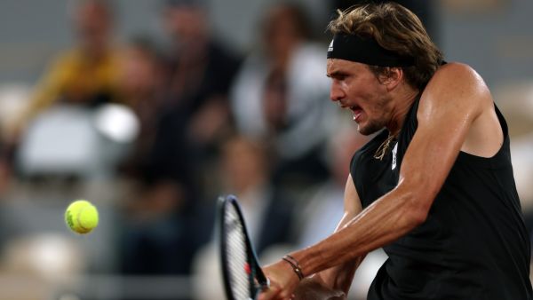 Germany's Alexander Zverev plays a backhand return to Spain's Rafael Nadal during their men's semi-final singles match on day thirteen of the Roland-Garros Open tennis tournament at the Court Philippe-Chatrier in Paris on June 3, 2022. (Photo by Thomas SAMSON / AFP)