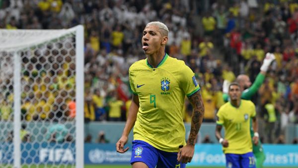 Brazil's forward #09 Richarlison celebrates scoring his team's first goal during the Qatar 2022 World Cup Group G football match between Brazil and Serbia at the Lusail Stadium in Lusail, north of Doha on November 24, 2022. (Photo by NELSON ALMEIDA / AFP)