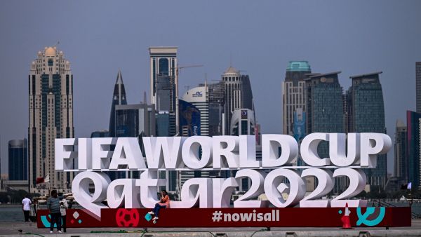 People visit the corniche adorned with a FIFA sign in Doha on November 5, 2022, ahead of the Qatar 2022 FIFA World Cup football tournament. (Photo by Jewel SAMAD / AFP)