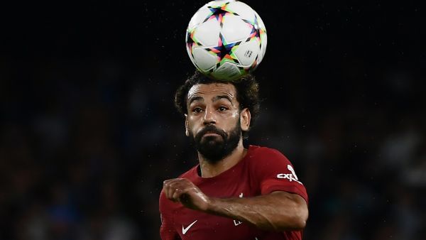 Liverpool's Egyptian forward Mohamed Salah runs with the ball during the UEFA Champions League Group A first leg football match between SSC Napoli and Liverpool FC at the Diego Armando Maradona Stadium in Naples on September 7, 2022. (Photo by Filippo MONTEFORTE / AFP)