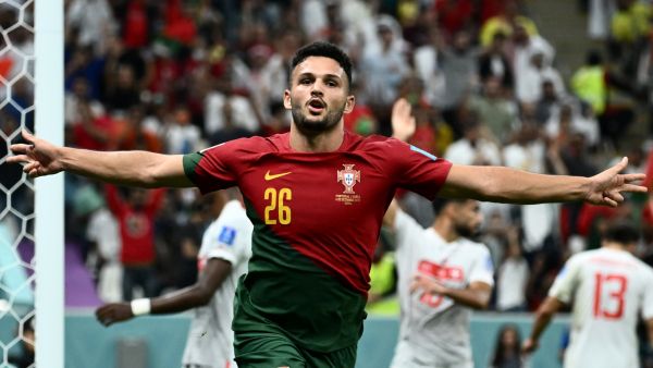 Portugal's forward #26 Goncalo Ramos celebrates scoring his team's fifth goal, his hat-trick, during the Qatar 2022 World Cup round of 16 football match between Portugal and Switzerland at Lusail Stadium in Lusail, north of Doha on December 6, 2022. (Photo by Jewel SAMAD / AFP)