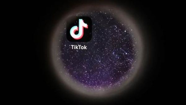 In this file photo taken on October 5, 2021 the logo of Chinese social networking service TikTok is seen on a smartphone screen. 