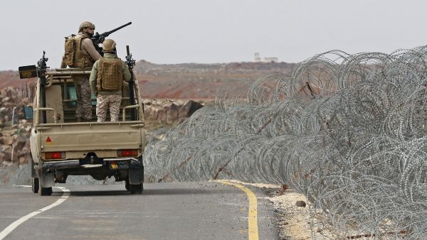 Jordanian guards patrol the Jordan-Syria border