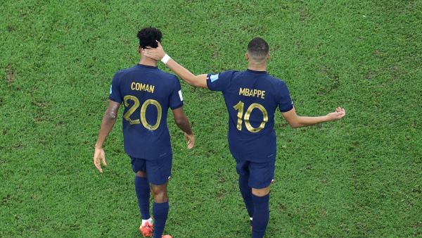 France's forward #10 Kylian Mbappe (R) consoles France's forward #20 Kingsley Coman (L) after Coman missed in the penalty shoot-out during the Qatar 2022 World Cup final football match between Argentina and France at Lusail Stadium in Lusail, north of Doha on December 18, 2022. (Photo by Giuseppe CACACE / AFP)