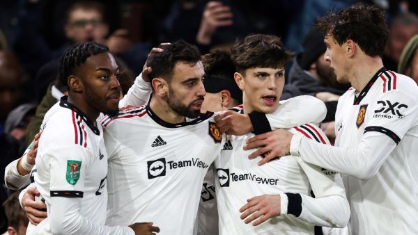 Manchester United's Portuguese midfielder Bruno Fernandes (2nd L) celebrates with teammates after scoring his team third goal during the English League Cup semi-final first-leg football match between Nottingham Forest and Manchester United, at The City Ground stadium, in Nottingham, central England, on January 25, 2023. (Photo by Darren Staples / AFP)