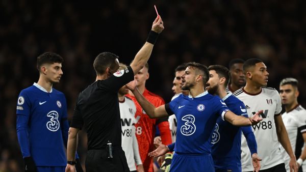 English referee David Coote shows a red card to Chelsea's Portuguese striker Joao Felix (not pictured) during the English Premier League football match between Fulham and Chelsea at Craven Cottage in London on January 12, 2023. (Photo by Ben Stansall / AFP)