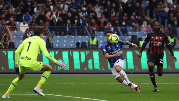 Inter Milan's Argentinian forward Lautaro Martinez (2nd-R) shoots to score his teams third goal during the Italian SuperCup football match between AC Milan and Inter Milan, at the King Fahd International Stadium in Riyadh on January 18, 2023. (Photo by Giuseppe CACACE / AFP)