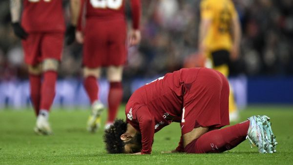 Liverpool's Egyptian striker Mohamed Salah prays after scoring his team's second goal during the English FA Cup third round football match between Liverpool and Wolverhampton Wanderers at Anfield in Liverpool, north-west England on January 7, 2023. (Photo by Oli SCARFF / AFP)