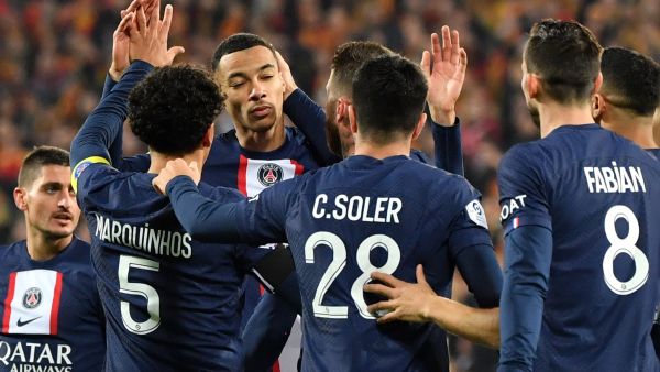Paris Saint-Germain's French forward Hugo Ekitike (3rd L) celebrates with teammates after scoring his team's first goal during the French L1 football match between RC Lens and Paris Saint Germain (PSG) at the Bollaert-Delelis Stadium in Lens, northern France on January 1, 2023. (Photo by FRANCOIS LO PRESTI / AFP)