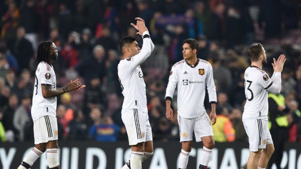 Manchester United's players react at the end of the UEFA Europa League round of 32 first-leg football match between FC Barcelona and Manchester United at the Camp Nou stadium in Barcelona, on February 16, 2023. (Photo by Josep LAGO / AFP)