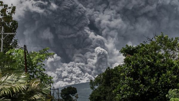 Thick smoke rises during an eruption from Mount Merapi, Indonesia’s most active volcano
