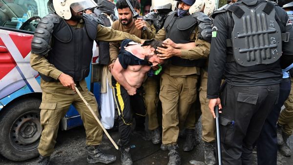 Pakistani police fired tear gas into Imran Khan’s home