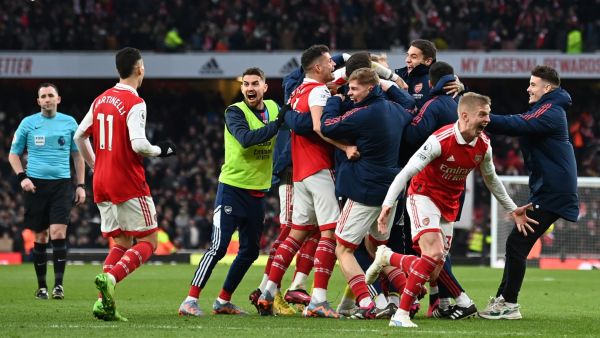 Arsenal's English midfielder Reiss Nelson (unseen) celebrates after scoring his team third goal of the team during the English Premier League football match between Arsenal and Bournemouth at the Emirates Stadium in London on March 4, 2023. (Photo by Glyn KIRK / AFP)