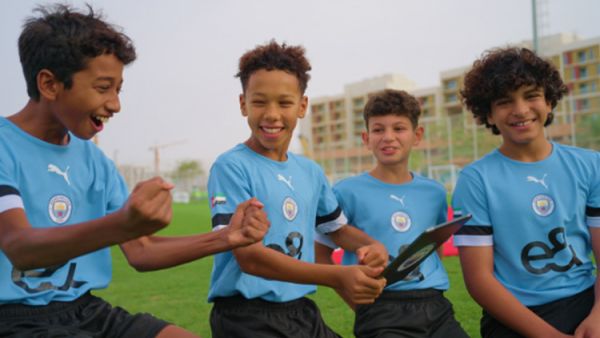 During the event e& and manchester city surprise talented player programme participants with opportunity of a lifetime