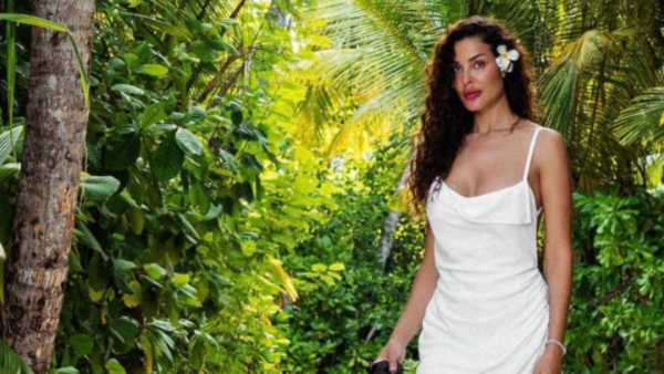 Nadine Njeim dances with a Pizza Dough