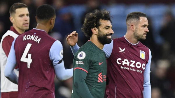 Liverpool's Egyptian striker Mohamed Salah (2nd R) congratulates Aston Villa's English striker Danny Ings (R) at the end of the English Premier League football match between Aston Villa and Liverpool at Villa Park in Birmingham, central England on December 26, 2022. (Photo by Oli SCARFF / AFP) 