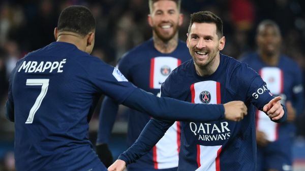 Paris Saint-Germain's Argentine forward Lionel Messi (R) celebrates with Paris Saint-Germain's French forward Kylian Mbappe (L) after scoring a goal during the French L1 football match between Paris Saint-Germain (PSG) and FC Nantes at The Parc des Princes Stadium in Paris on March 4, 2023. (Photo by FRANCK FIFE / AFP)