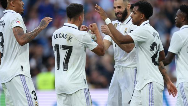 Real Madrid's French forward Karim Benzema (C) celebrates with teammates scoring his team's third goal during the Spanish league football match between Real Madrid CF and UD Almeria at the Santiago Bernabeu stadium in Madrid on April 29, 2023. (Photo by Thomas COEX / AFP)