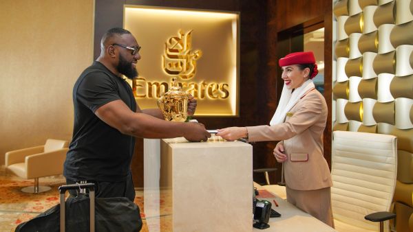 South African rugby legend, Tendai Mtawarira and the Webb Ellis Cup at the Emirates First Class Lounge in Dubai. Excitement soars in Paris as Emirates passes the Webb Ellis Cup to the host nation