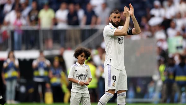 Real Madrid's French forward Karim Benzema applauds next to his son at the end of the Spanish league football match between Real Madrid CF and Athletic Club Bilbao at the Santiago Bernabeu stadium in Madrid on June 4, 2023. (Photo by Pierre-Philippe MARCOU / AFP)