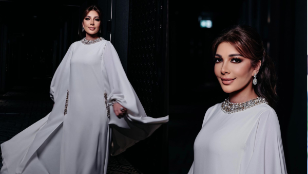 Assala wears bathrobe to brother's wedding