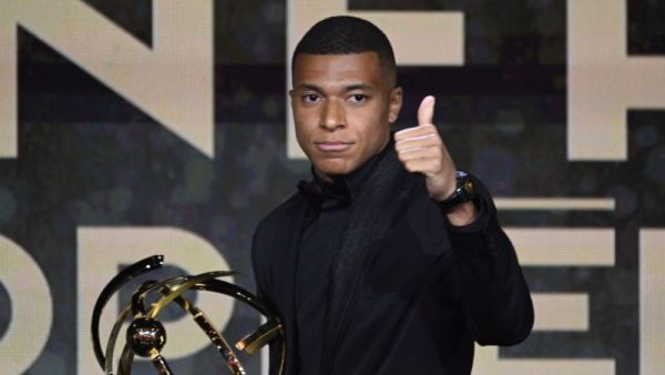 Paris Saint-Germain's French forward Kylian Mbappe thumbs up after receiving the Best Ligue 1 Player award during the 31th edition of the UNFP (French National Professional Football players Union) trophy ceremony, in Paris May 28, 2023. (Photo by Bertrand GUAY / AFP)