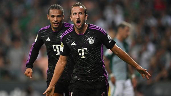 Bayern Munich's English forward #09 Harry Kane celebrates scoring the 0-2 goal with his team-mate Bayern Munich's German midfielder #10 Leroy Sane during the German first division Bundesliga football match between Werder Bremen and FC Bayern Munich in Bremen, northern Germany, on August 18, 2023. (Photo by INA FASSBENDER / AFP)