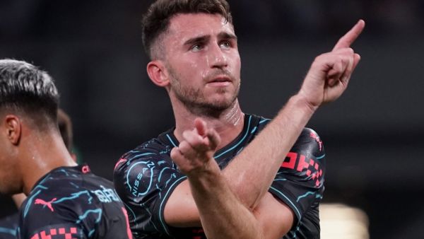 Manchester City defender Aymeric Laporte (R) reacts after his goal during the International friendly football match between Bayern Munich of Germany and Manchester City of England at the National Stadium in Tokyo on July 26, 2023. (Photo by Kazuhiro NOGI / AFP)