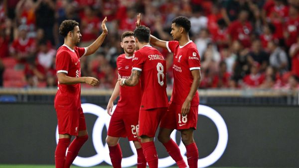 Liverpool's Dutch striker Cody Gakpo (R) celebrates with teammates after scoring a goal against Bayern Munich during the Singapore Festival of Football pre-season friendly match in Singapore on August 2, 2023. (Photo by Mohd RASFAN / AFP)