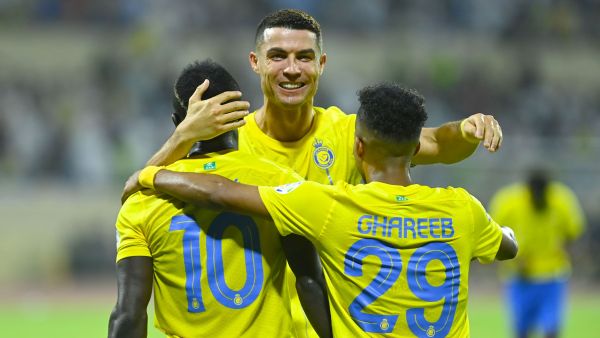 Nassr's Senegalese Forward #10 Sadio Mane, Nassr's Portuguese forward #07 Cristiano Ronaldo and Nassr's Saudi midfielder #29 Abdulrahman Ghareeb celebrate a goal during the Saudi Pro League football match between Al-Nassr and Al-Fateh at the Prince Abdullah Bin Jalawi Stadium in al-Hasa, on August 25, 2023. (Photo by Ali Al-HAJI / AFP)