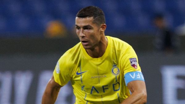 Nassr's Portuguese forward Cristiano Ronaldo runs with the ball during the 2023 Arab Club Champions Cup group C football match between Saudi Arabia's Al-Nassr and Saudi Arabia's Al-Shabab at the King Fahd Stadium in Taif on July 28, 2023. (Photo by AFP)