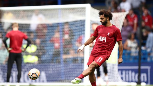 Liverpool's Egyptian striker #11 Mohamed Salah warms up ahead of the English Premier League football match between Chelsea and Liverpool at Stamford Bridge in London on August 13, 2023. (Photo by HENRY NICHOLLS / AFP)