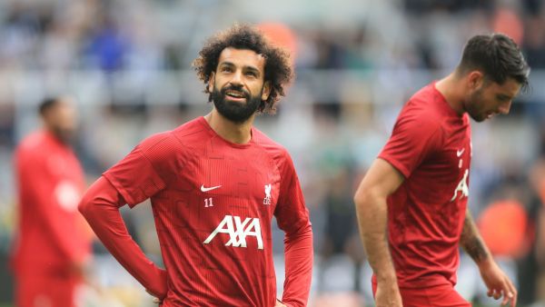 Liverpool's Egyptian striker #11 Mohamed Salah warms-up during the English Premier League football match between Newcastle United and Liverpool at St James' Park in Newcastle-upon-Tyne, north east England on August 27, 2023. (Photo by Lindsey Parnaby / AFP)