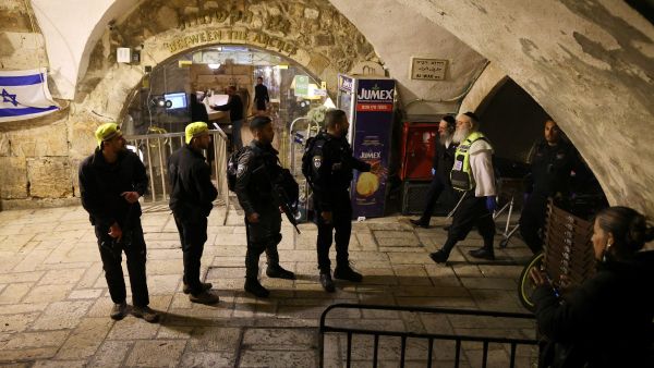 Israeli security forces gather near the scene of a stabbing attack in Jerusalem's Old City on March 7, 2022. AFP
