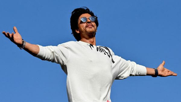 Bollywood actor Shah Rukh Khan greets fans with his iconic pose at his residence in Mumbai on June 10, 2023. AFP Shah Rukh Khan