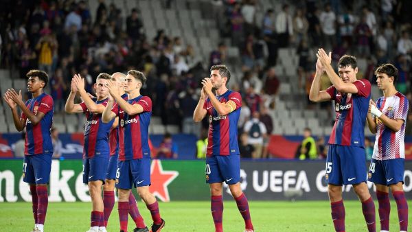 Barcelona's players celebrate at the end of the UEFA Champions League 1st round day 1 Group H football match between FC Barcelona and Royal Antwerp FC at the Estadi Olimpic Lluis Companys in Barcelona on September 19, 2023. (Photo by Josep LAGO / AFP)