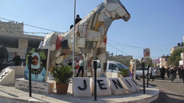 statue made of ambulances remains