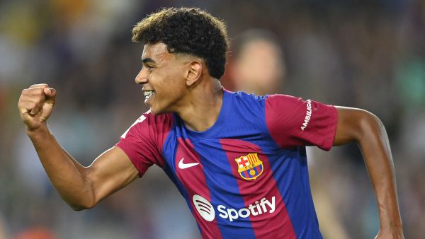 Barcelona's Spanish forward #27 Lamine Yamal celebrates Sevilla's Spanish defender Sergio Ramos' owngoal during the Spanish Liga football match between FC Barcelona and Sevilla FC at the Estadi Olimpic Lluis Companys in Barcelona on September 29, 2023. (Photo by Pau BARRENA / AFP)