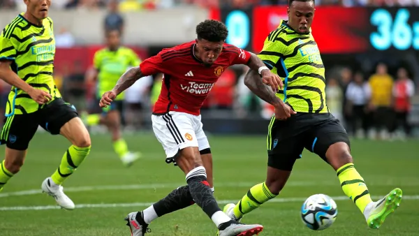 Manchester United's English midfielder Jadon Sancho (C) shoots the ball to score his team's first goal during the friendly football match between Manchester United and Arsenal at MetLife Stadium in East Rutherford, New Jersey, on July 22, 2023. (Photo by Leonardo Munoz / AFP)